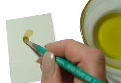 Painting melted wax onto paper